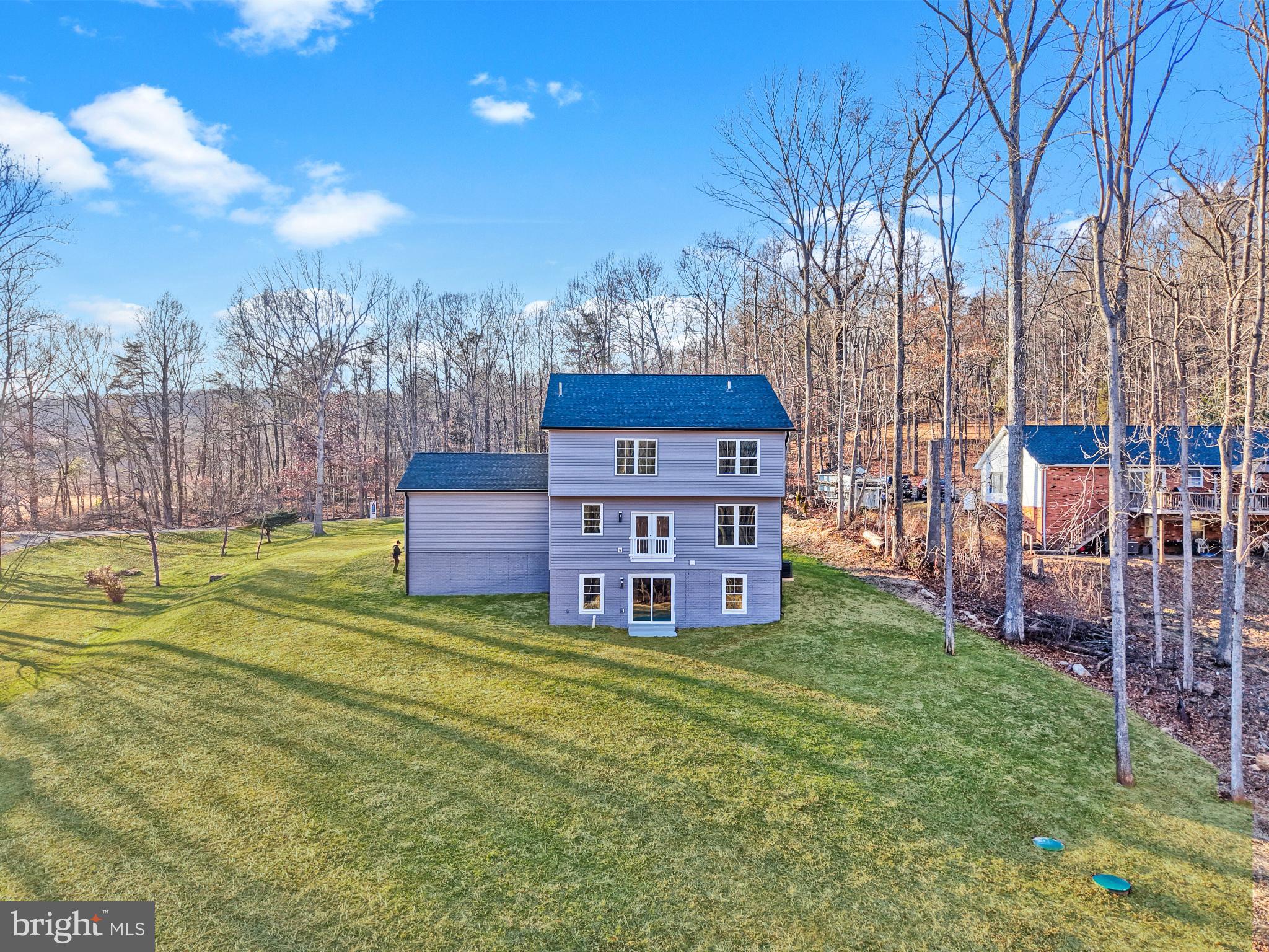 5393 Merry Oaks Road The Plains, VA 20198 - Photo 52 of 58 a view of a house with a big yard and large trees