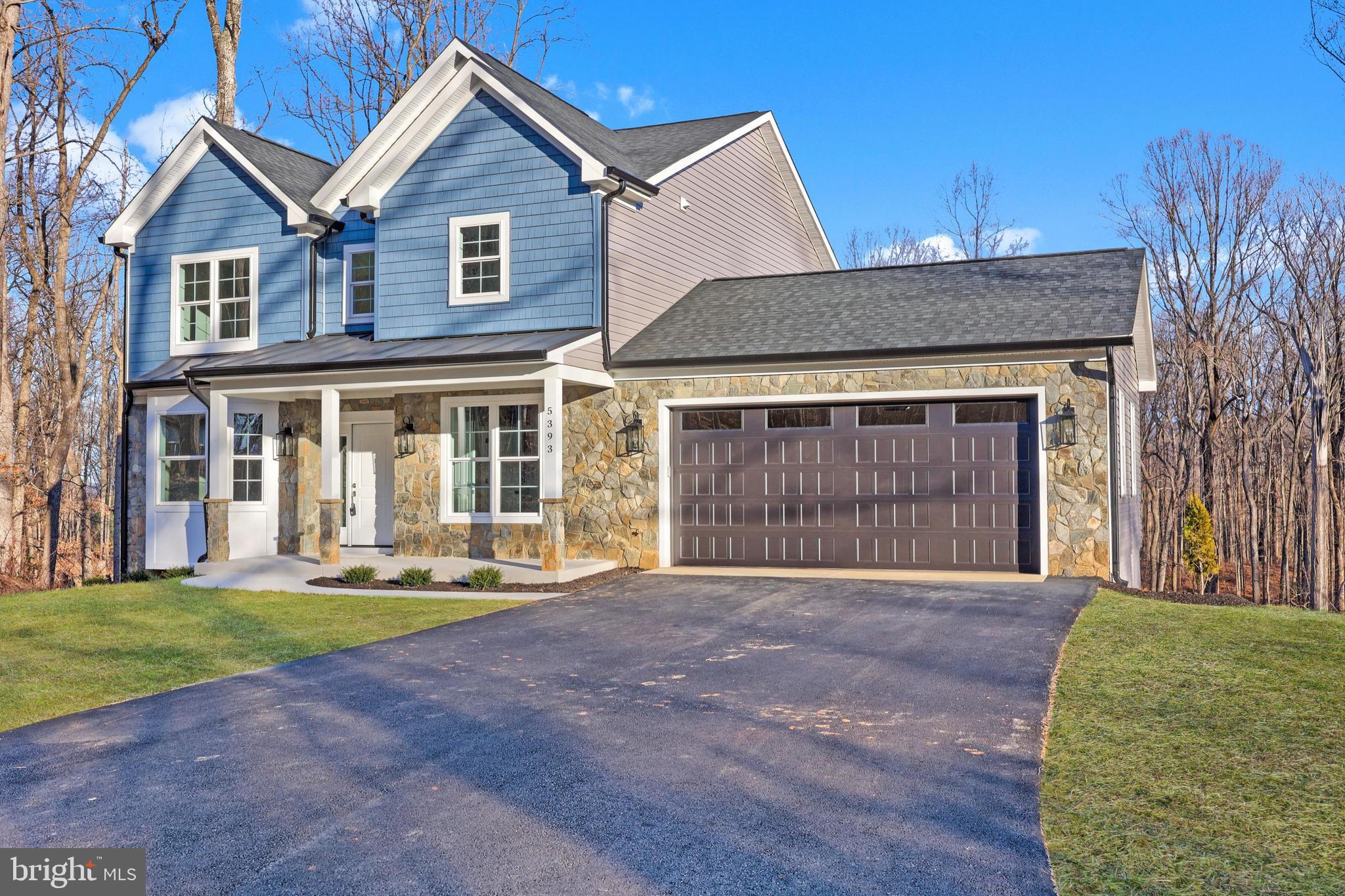 5393 Merry Oaks Road The Plains, VA 20198 - Photo 58 of 58 a front view of a house with a yard and garage
