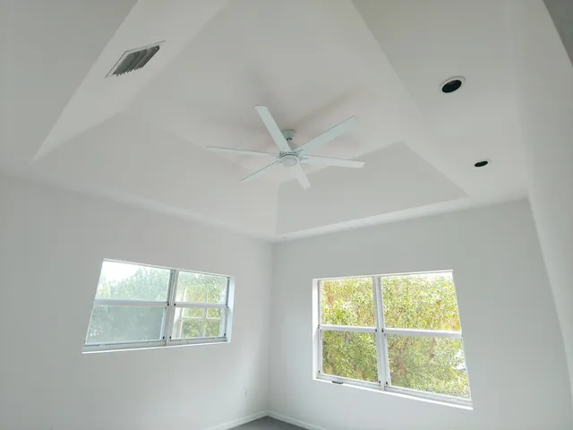 a view of an empty room with a window