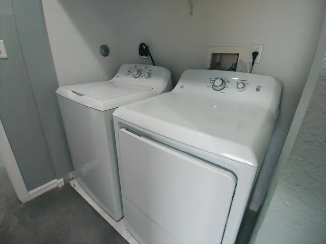 a utility room with dryer and washer