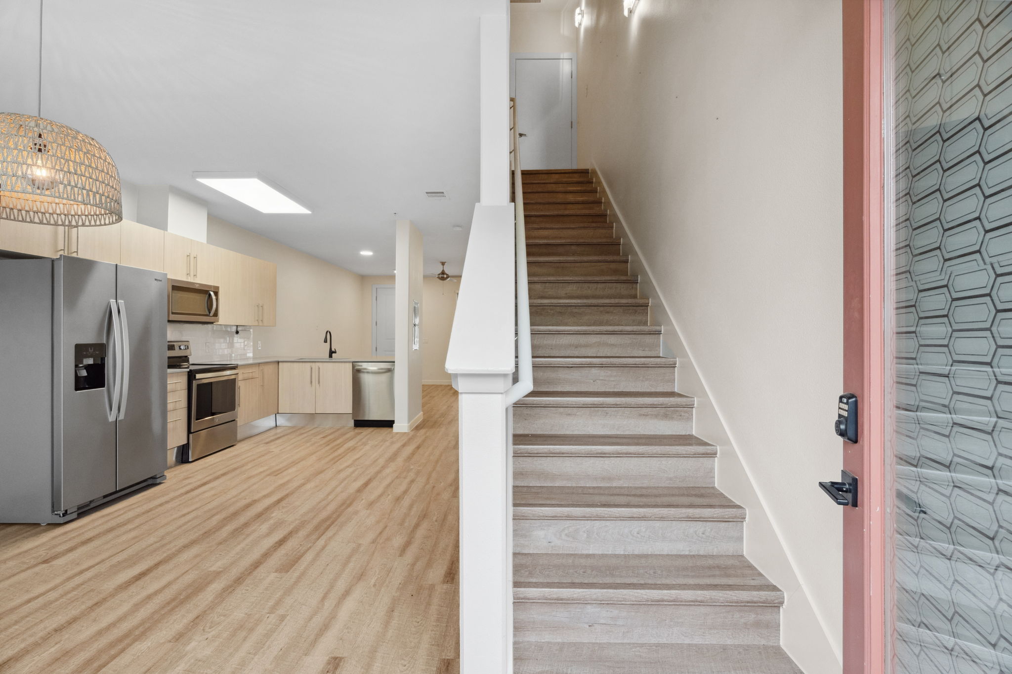 7805 Cooper Lane, Unit 606 Austin, TX 78745 - Photo 2 of 35 a view of a kitchen with wooden floor and electronic appliances
