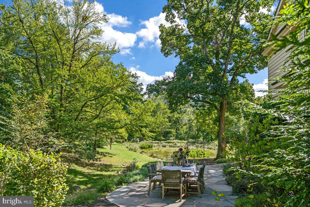 720 Swedesford Road Lower Gwynedd, PA 19002 - Photo 15 of 79 a view of a yard with chairs and table