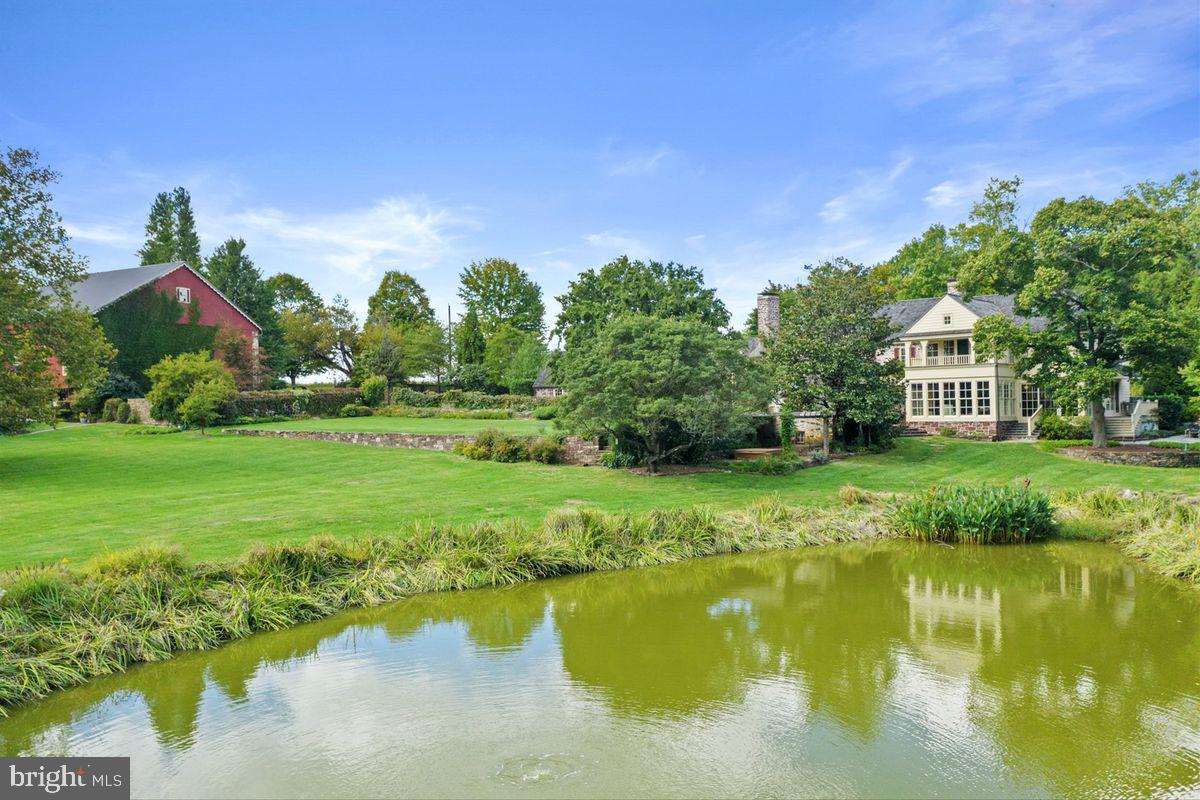 720 Swedesford Road Lower Gwynedd, PA 19002 - Photo 3 of 79 a view of a garden with a building in the background