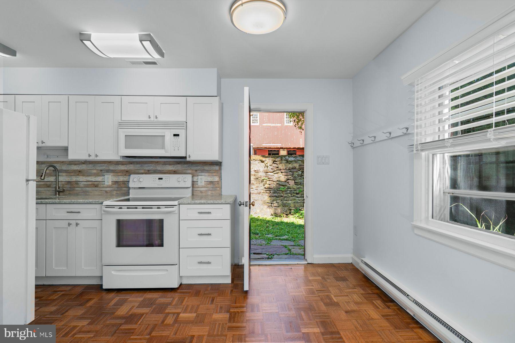 720 Swedesford Road Lower Gwynedd, PA 19002 - Photo 60 of 79 a kitchen with stainless steel appliances granite countertop a stove and a refrigerator