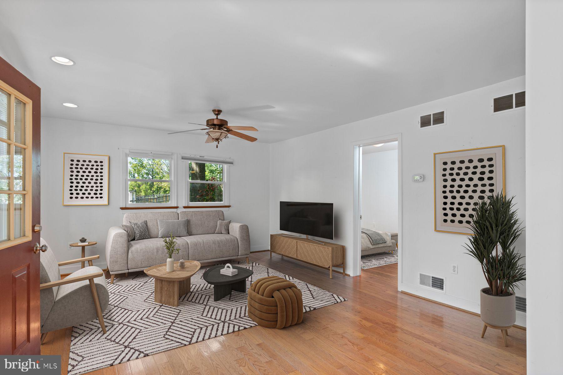 720 Swedesford Road Lower Gwynedd, PA 19002 - Photo 71 of 79 a living room with furniture a fireplace and a flat screen tv