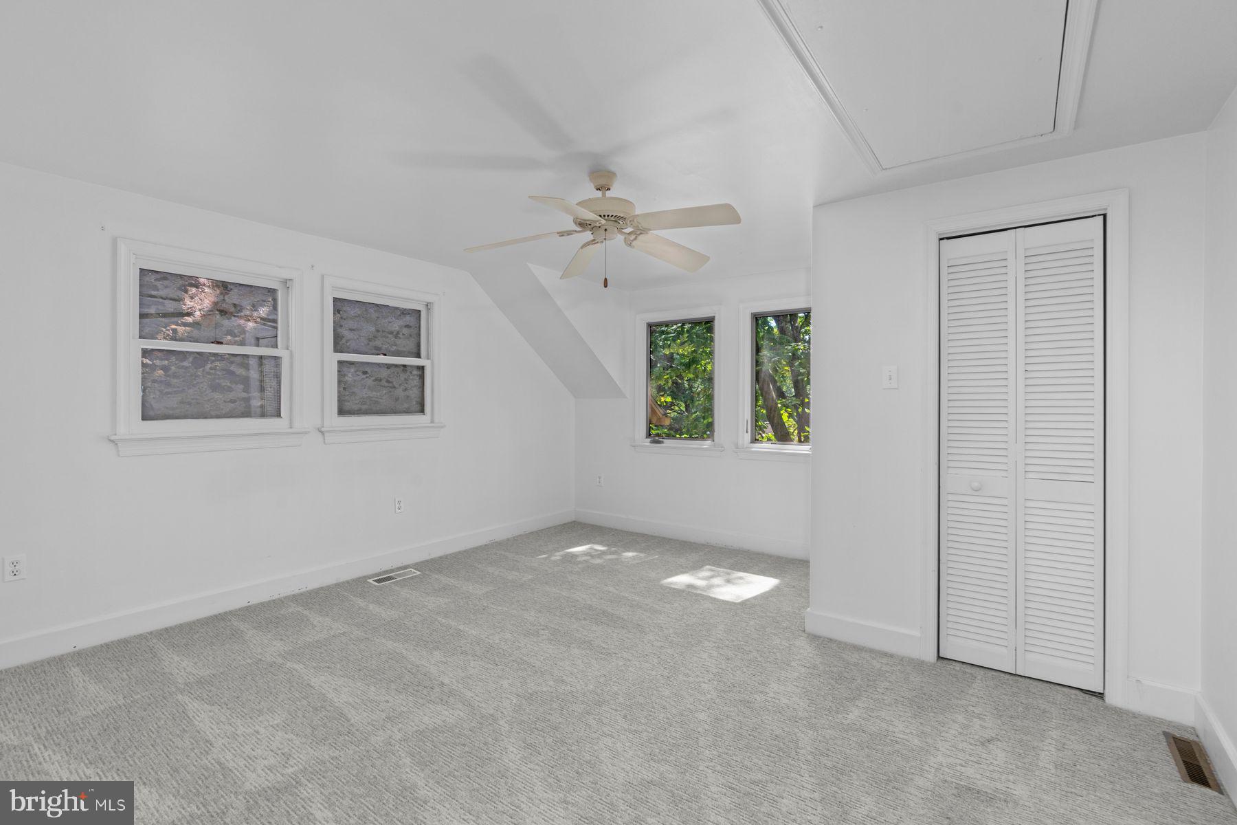 720 Swedesford Road Lower Gwynedd, PA 19002 - Photo 77 of 79 an empty room with windows and ceiling fan