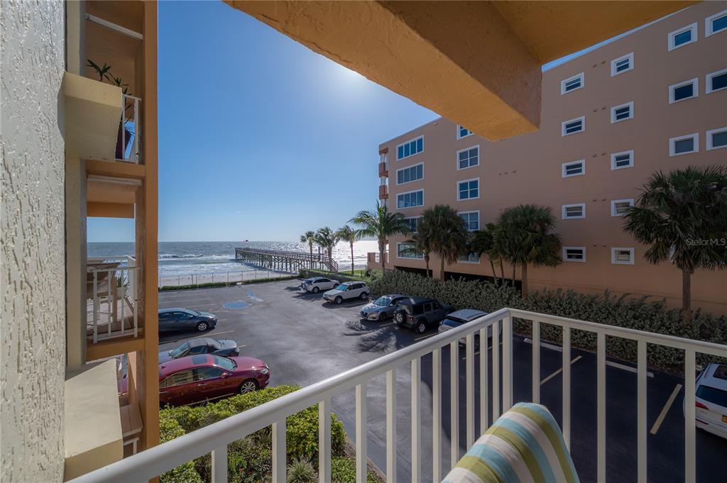 16308 Gulf Boulevard, Unit 209 Redington Beach, FL 33708 - Photo 27 of 54 a view of a balcony with chairs and potted plants