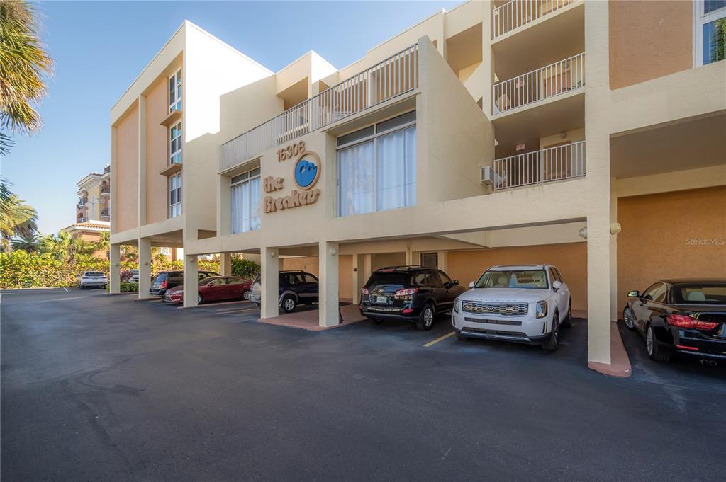 16308 Gulf Boulevard, Unit 209 Redington Beach, FL 33708 - Photo 43 of 54 a car parked in front of a building