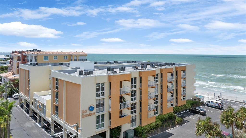 16308 Gulf Boulevard, Unit 209 Redington Beach, FL 33708 - Photo 44 of 54 a view of a building with outdoor space and ocean view