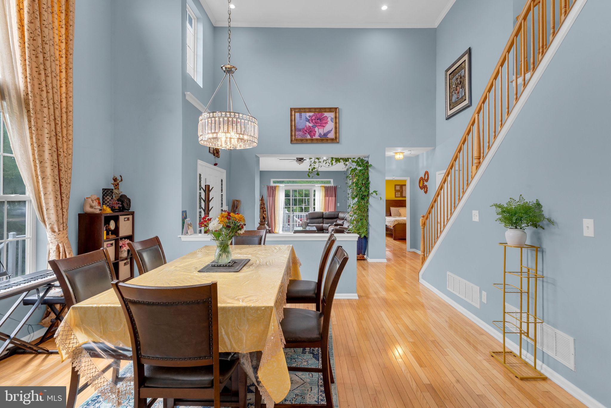 16 Cardiff Court Princeton Junction, NJ 08550 - Photo 14 of 60 a view of a dining room with furniture and a chandelier