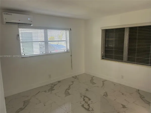 a view of a room that has a window in it