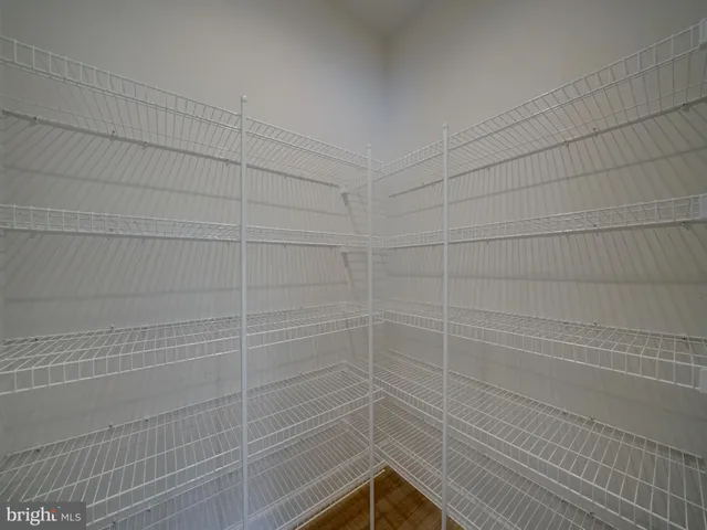 a white toilet and a bath tub sitting next to a window