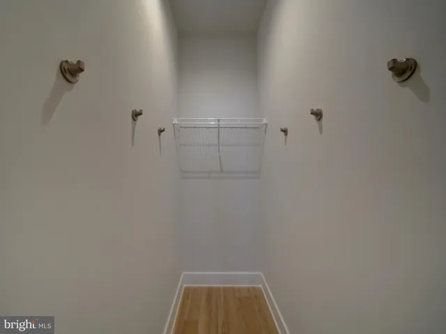 a view of a room with racks on the wall