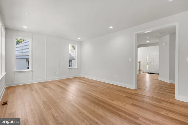 a kitchen with stainless steel appliances a sink a stove and cabinets