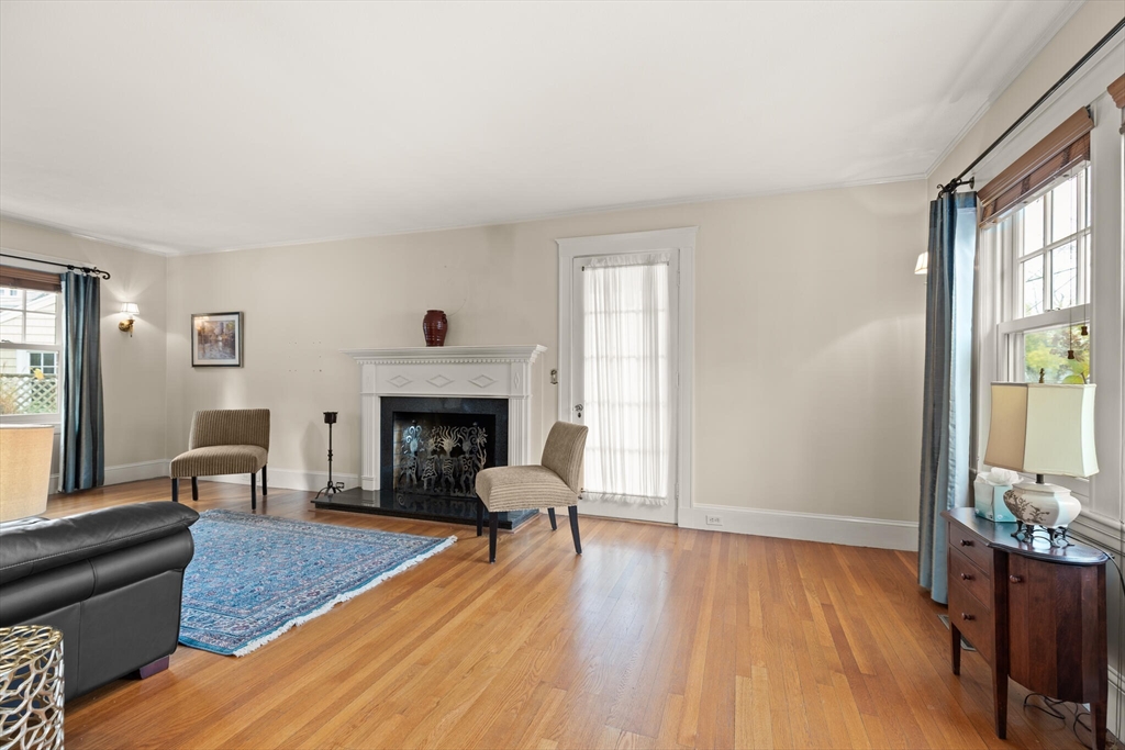 177 Nevada Street Newton, MA 02460 - Photo 11 of 40 a living room with furniture and a fireplace