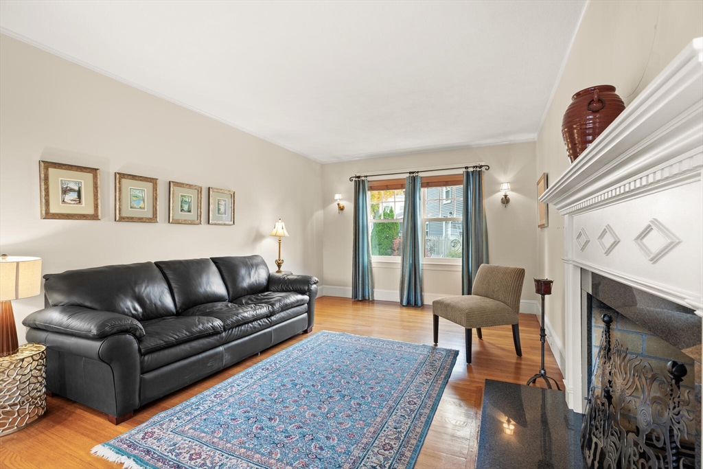 177 Nevada Street Newton, MA 02460 - Photo 13 of 40 a living room with furniture and a fireplace