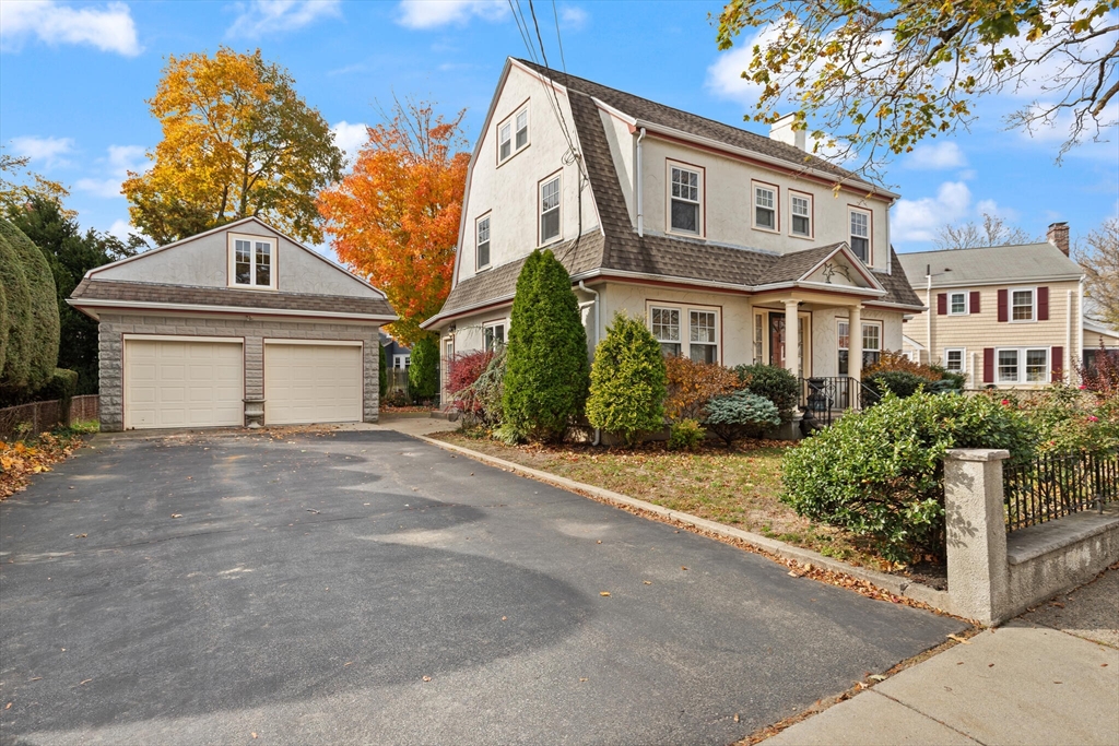 177 Nevada Street Newton, MA 02460 - Photo 2 of 40 a front view of a house with garden