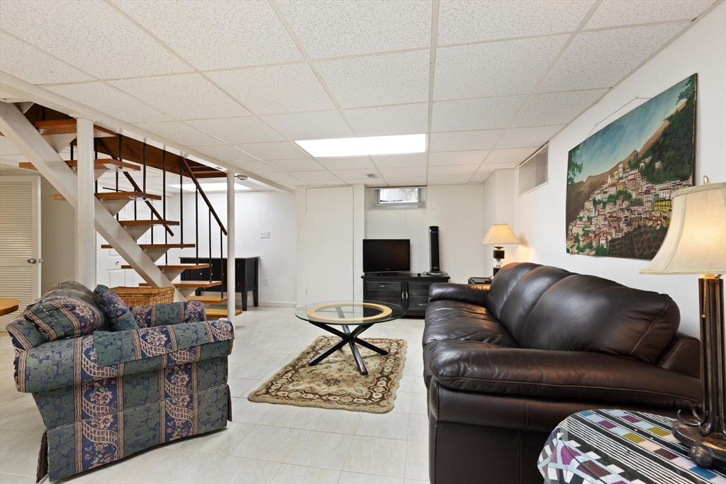 177 Nevada Street Newton, MA 02460 - Photo 23 of 40 a living room with furniture and a flat screen tv