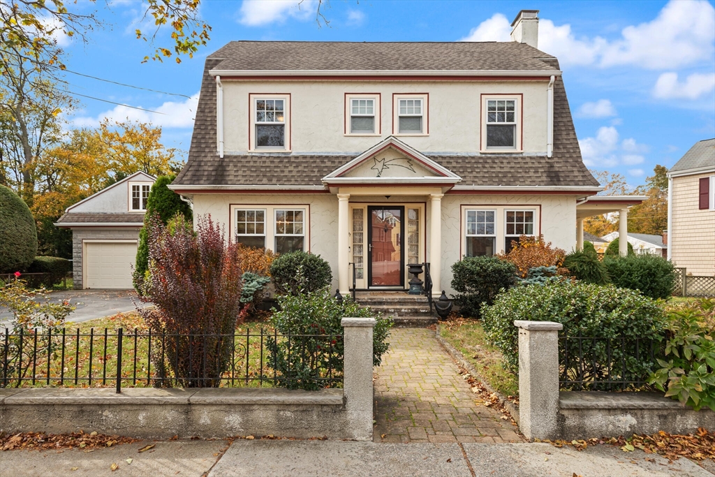 177 Nevada Street Newton, MA 02460 - Photo 3 of 40 a front view of a house with a yard and tree