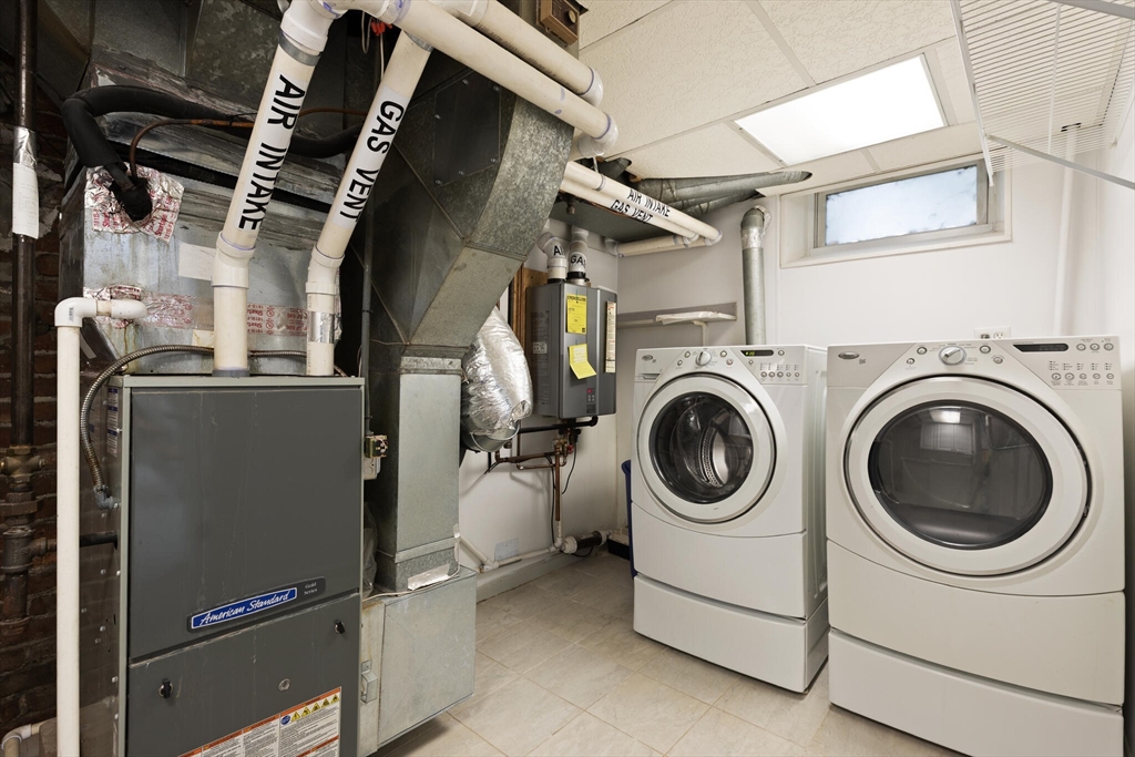 177 Nevada Street Newton, MA 02460 - Photo 32 of 40 a utility room with dryer and washer