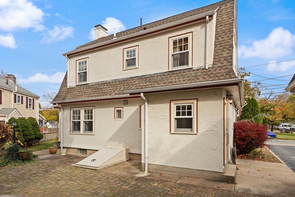 177 Nevada Street Newton, MA 02460 - Photo 37 of 40 a view of a house with a yard