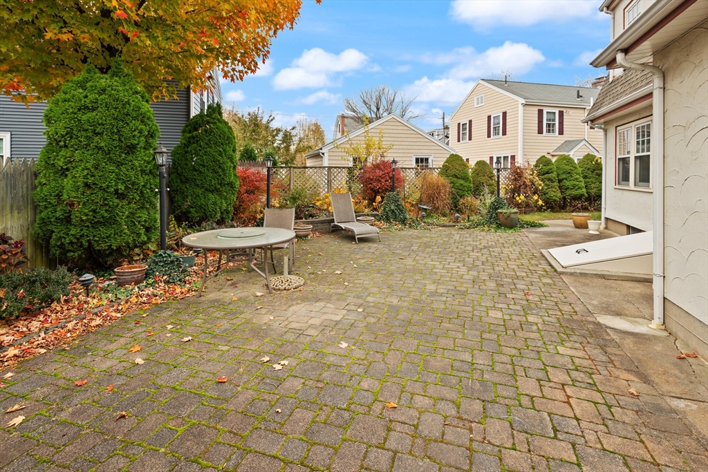 177 Nevada Street Newton, MA 02460 - Photo 39 of 40 a view of a patio with iron fence