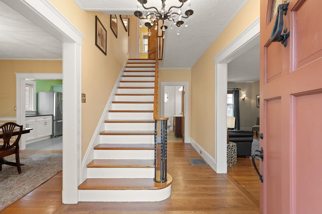 177 Nevada Street Newton, MA 02460 - Photo 8 of 40 a view of entryway and hall with wooden floor