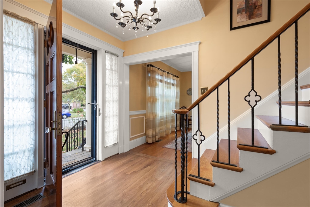 177 Nevada Street Newton, MA 02460 - Photo 9 of 40 a view of entryway with wooden floor and windows