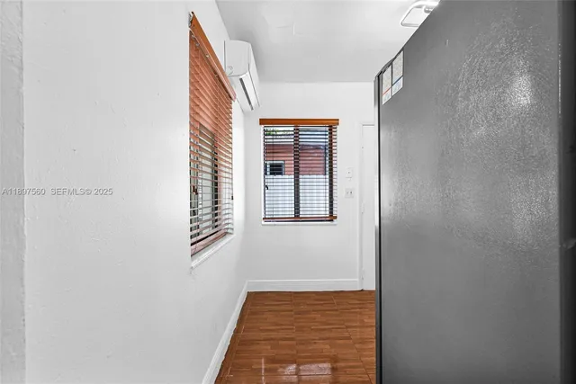 a view of hallway with windows