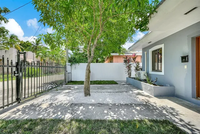 a view of backyard with green space