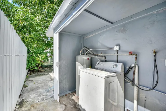a utility room with dryer and washer