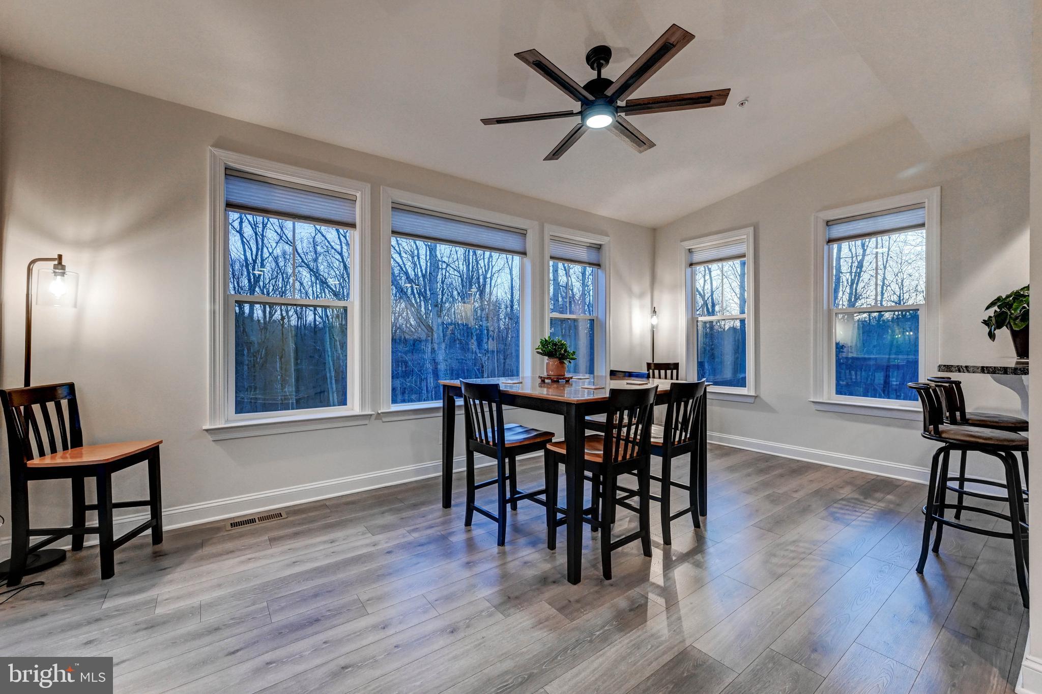 2613 Cotter Road Manchester, MD 21102 - Photo 17 of 26 a view of a a dining room with furniture window and wooden floor