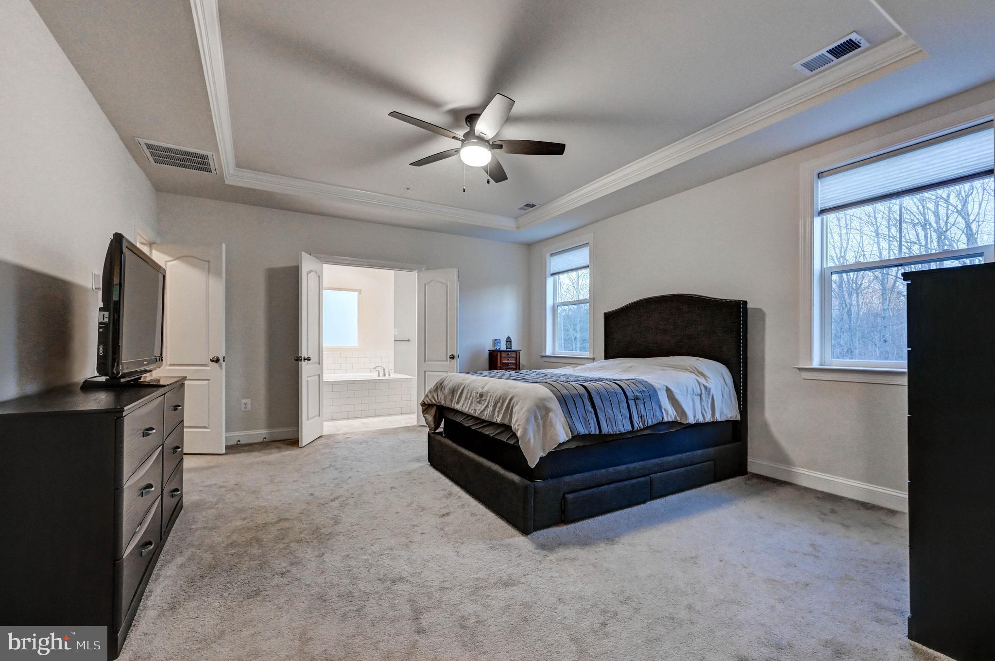 2613 Cotter Road Manchester, MD 21102 - Photo 19 of 26 a bedroom with a bed and a flat screen television