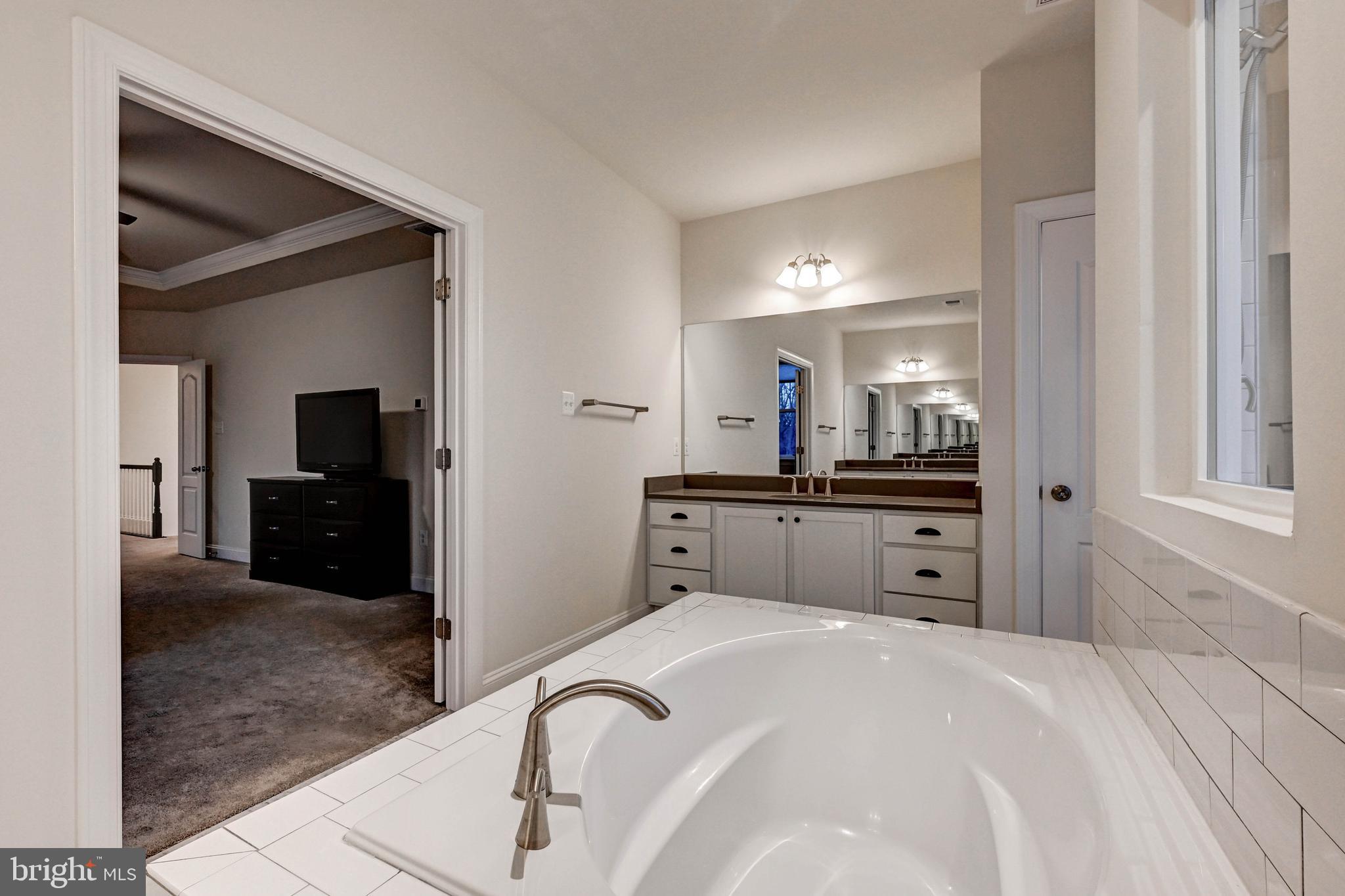 2613 Cotter Road Manchester, MD 21102 - Photo 20 of 26 a bedroom with a bed and a bathroom