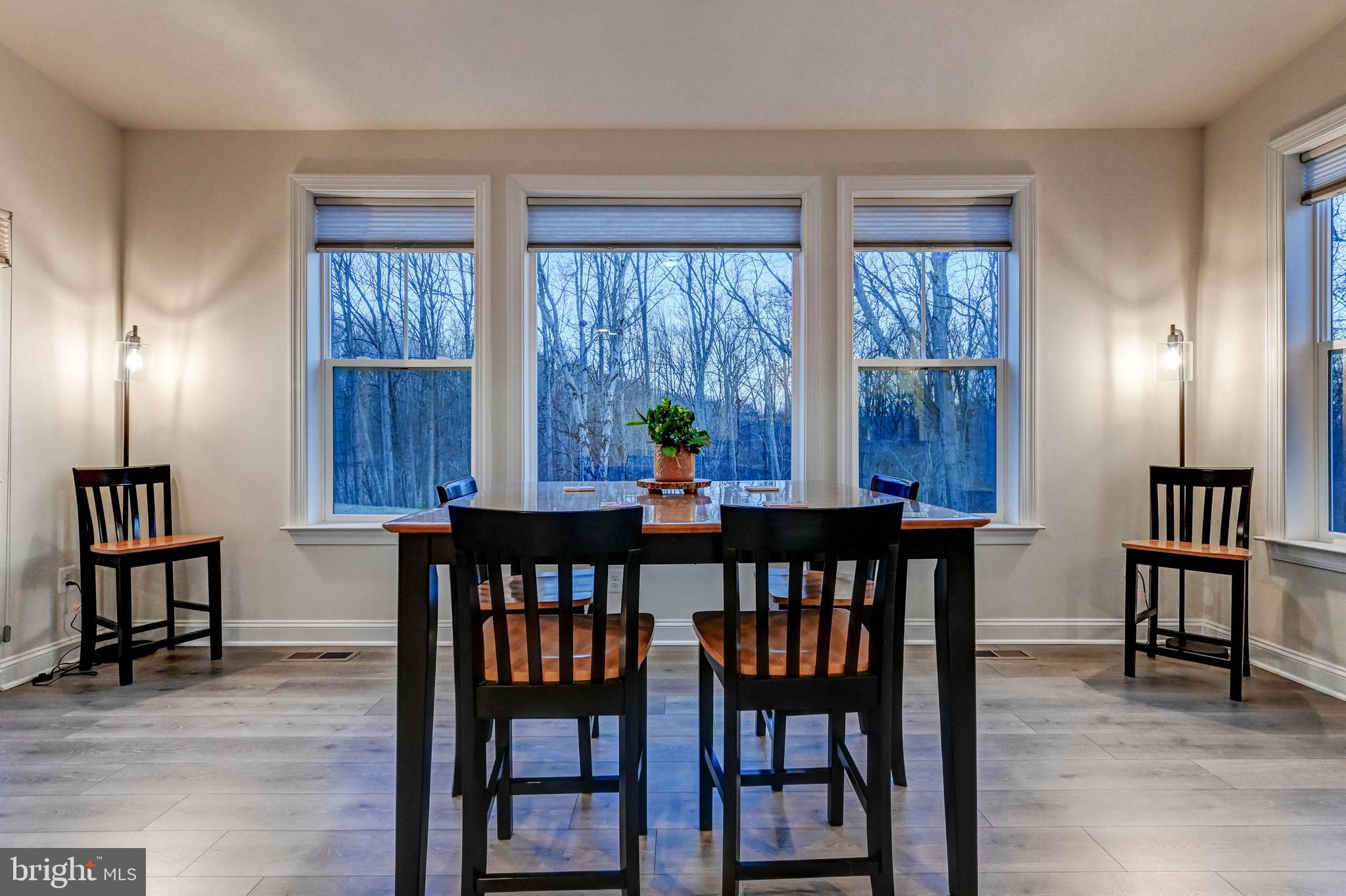 2613 Cotter Road Manchester, MD 21102 - Photo 3 of 26 a view of a dining room with furniture window and wooden floor