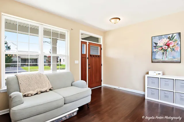 a living room with furniture and a window