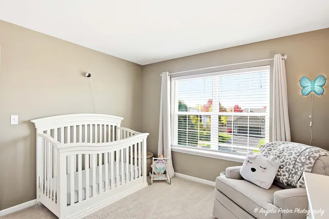 a bedroom with furniture and windows