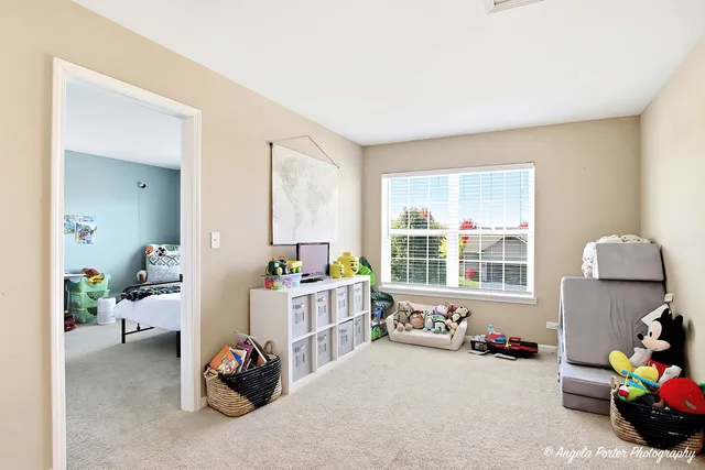 a room with furniture and a large window