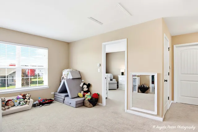 a bedroom with furniture and windows