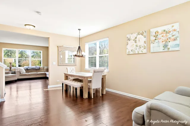 a view of a livingroom with furniture and a large window
