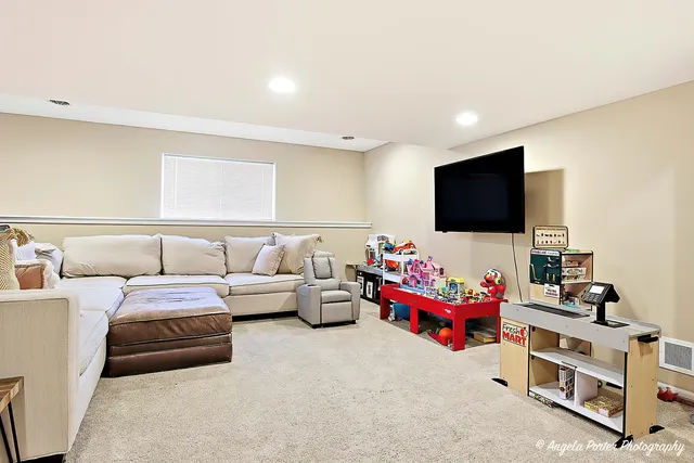 a bedroom with furniture and flat screen tv