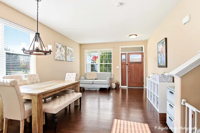 a view of a livingroom with furniture window and wooden floor