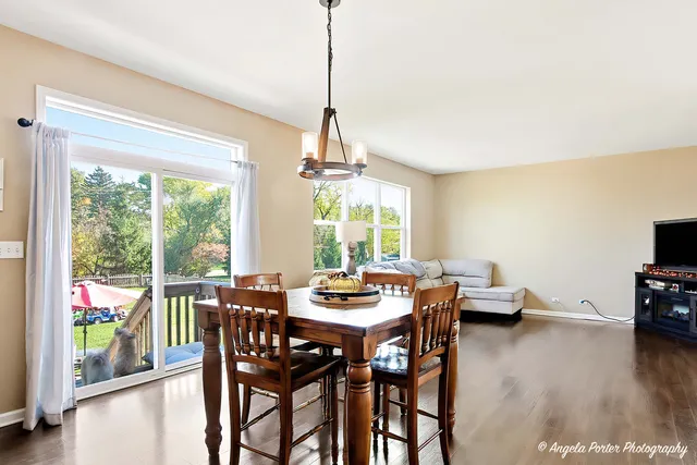 a dining room with furniture window wooden floor