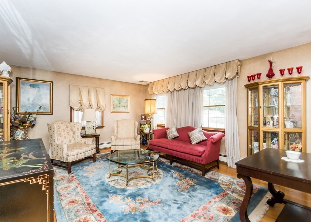 35 Woodchester Road Waltham, MA 02451 - Photo 11 of 39 a living room with furniture a rug and a window