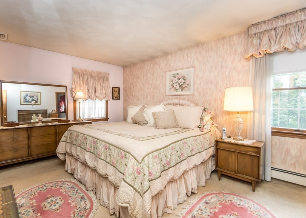 35 Woodchester Road Waltham, MA 02451 - Photo 12 of 39 a bedroom with a bed and a cabinets