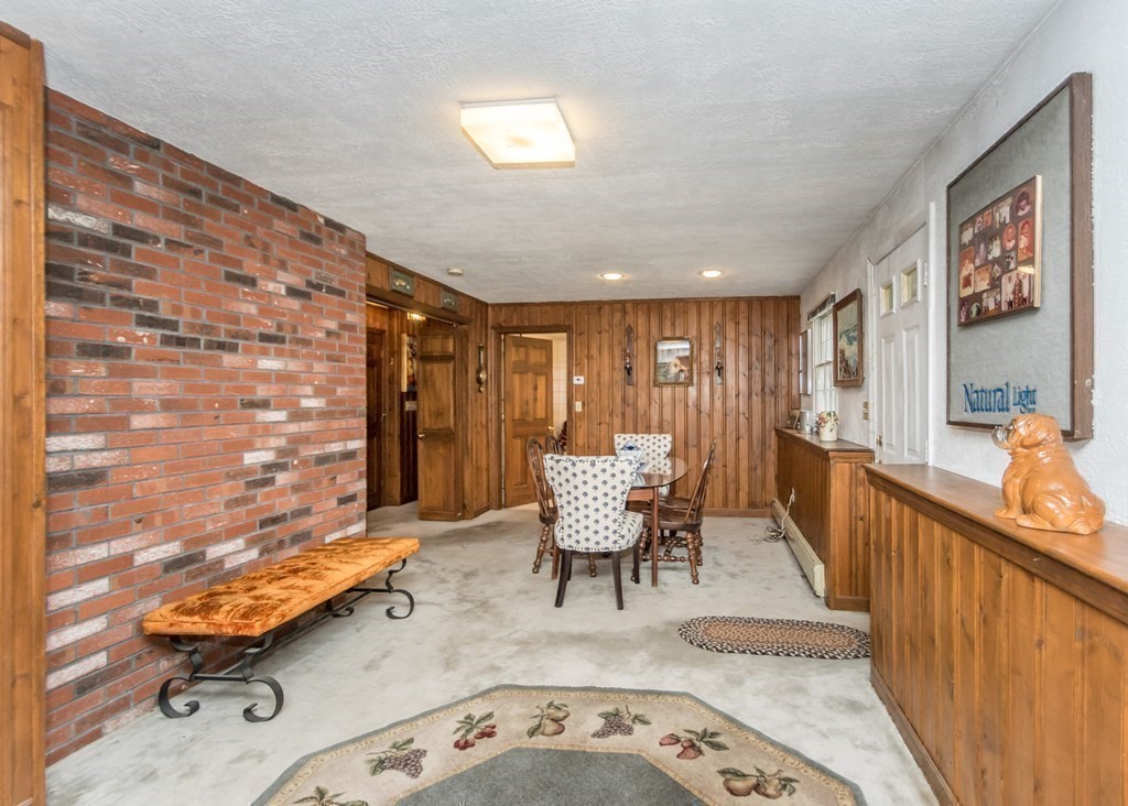 35 Woodchester Road Waltham, MA 02451 - Photo 21 of 39 a dining room with furniture and wooden floor