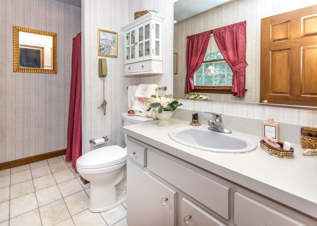 35 Woodchester Road Waltham, MA 02451 - Photo 24 of 39 a bathroom with a sink toilet and mirror