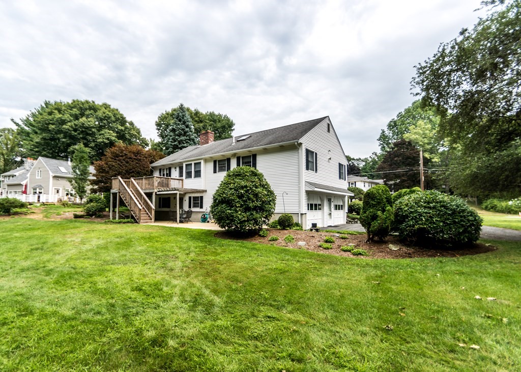 35 Woodchester Road Waltham, MA 02451 - Photo 26 of 39 a view of a house with a big yard and large trees