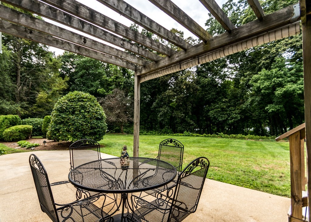35 Woodchester Road Waltham, MA 02451 - Photo 29 of 39 a patio with a yard table and chairs