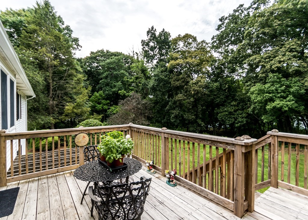 35 Woodchester Road Waltham, MA 02451 - Photo 30 of 39 a view of a wooden deck with furniture